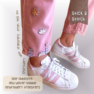 One leg of my pink overalls embroidered with flowers