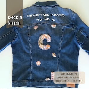 Me posing with my denim jacket. On the back of the jacket I have sewn embroidered felt patches. One of the patches is a capital letter decorated with flowers and the rest are flowers and leaves. Peel, stick, embroider and dissolve. Very easy.