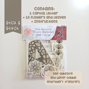 What does the pack contains.  It contains 1 capital letter to choose, 15 flowers and leaves and instructions in five languajes