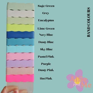 May include: A colour chart showing 12 different colours of watch bands. The colours are: Sage Green, Grey, Eucalyptus, Lime Green, Navy Blue, Dusty Blue, Sky Blue, Pastel Pink, Purple, Dusty Pink, and Hot Pink. The text "BAND COLOURS" is on the right side of the chart.