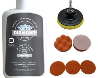 May include: A white bottle of Diamond Shine kitchen cleaner with a black and gray label, and a set of polishing pads and a backing plate. The cleaner is labeled "Pro Strength" and contains real diamonds. The pads are orange and tan.