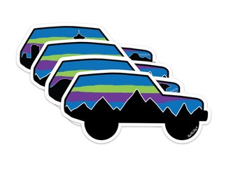 May include: Four sticker sheets featuring a silhouette of a car with a mountain range and a sunset sky in blue, green, purple, and black colors. The text "SixLites" is on the bottom right of the sticker sheet.