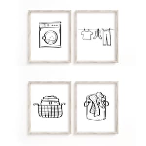以下が含まれることがあります： フレームに入った白黒のイラストが4つ。イラストは洗濯機、洗濯物干し、ランドリーバスケット、ランドリーハンパーを描いています。