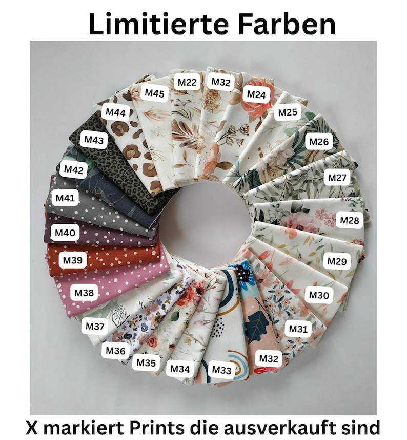 May include: A circular arrangement of folded fabric swatches featuring various patterns including floral, polka dot, leopard print, and abstract designs. Each swatch is labeled with a white tag numbered M22 through M45. The text reads Limitierte Farben and X markiert Prints die ausverkauft sind.