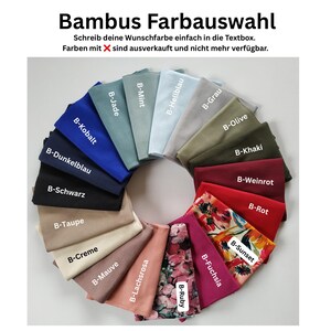 May include: A circular arrangement of fabric swatches in various solid colors and two floral patterns. Text at the top reads Bambus Farbauswahl, Schreib deine Wunschfarbe einfach in die Textbox. Farben mit X sind ausverkauft und nicht mehr verf&uuml;gbar.