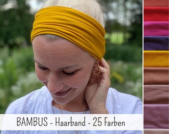 May include: A wide mustard yellow fabric headband made of bamboo material. The image includes a vertical color palette strip on the right side showing various fabric shades and the text BAMBUS - Haarband - 25 Farben overlaid on the bottom.