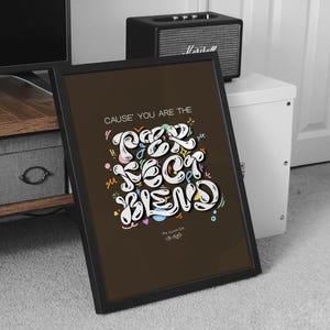 May include: A framed print with a brown background and white text that reads "CAUSE' YOU ARE THE PERFECT BLEND". The text is stylized with colorful accents and swirls. The print also includes the text "The Cause for the Vibes".