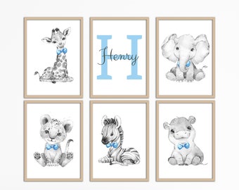 May include: A set of six framed prints featuring black and white illustrations of animals wearing blue bow ties. The prints include a giraffe, elephant, lion, zebra, hippopotamus, and a letter H with the name Henry.