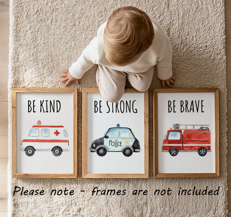 May include: Three framed wall art prints featuring watercolor illustrations of emergency vehicles. The first shows an ambulance with the text BE KIND, the second a police car with BE STRONG, and the third a fire truck with BE BRAVE. Please note - frames are not included.