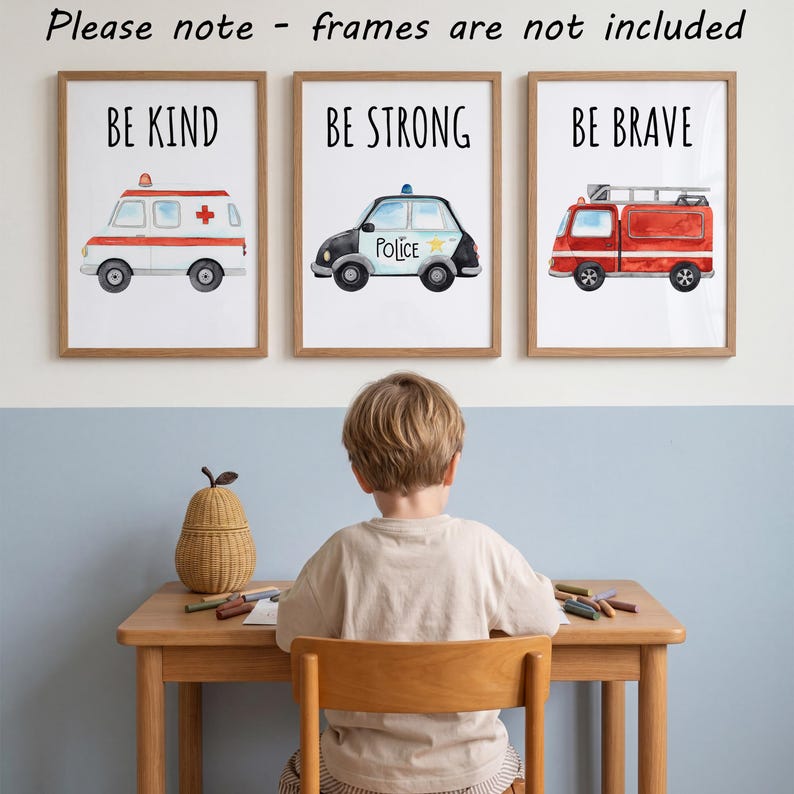 May include: Three wall art prints featuring watercolor illustrations of emergency vehicles. The first shows an ambulance with the text BE KIND, the second a police car with BE STRONG, and the third a fire truck with BE BRAVE. Please note - frames are not included.