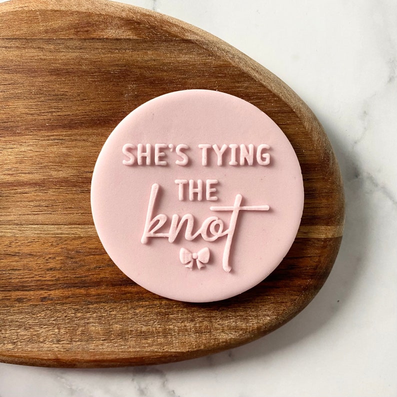 Bridal shower cookie embosser stamp
She’s tying the knot