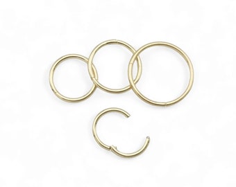 Surgical steel, 0.8mm/20g clicker 6mm,7mm,8mm and 10mm internal diameter, 18ct gold plated. Sold singly, not as a pair.