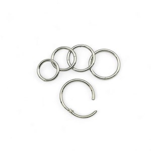 Titanium clicker, 1mm/18g thick, 6mm-10mm internal diameter. Sold singly, not as a pair.