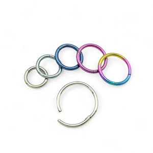 Titanium clicker 1.2mm/16g, 6mm-12mm internal diameter with anodised finish. Sold singly, not as a pair.