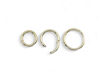 Surgical steel clicker, 1.6mm/14g, 8mm-12mm internal diameter with PVD gold finish. Sold singly, not as a pair.