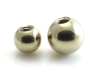 Titanium 4mm or 5mm ball with gold pvd finish for externally threaded 1.6mm/14g barbell and labret stud. Sold singly, not as a pair.