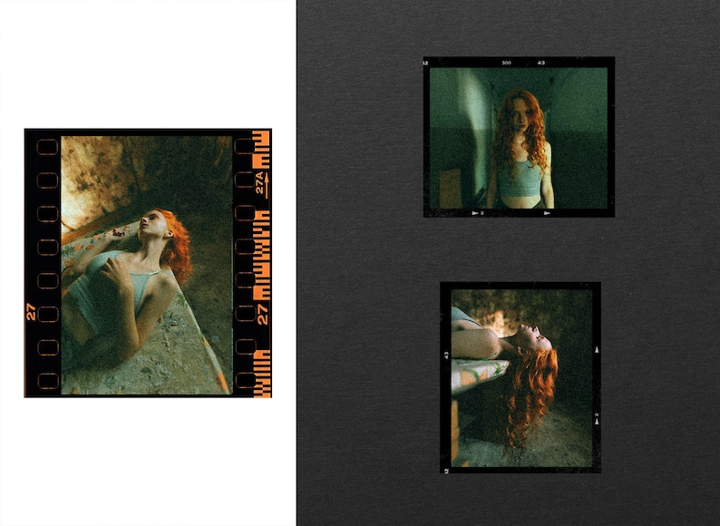 May include: A collection of three photographic film frames featuring a person with long, vibrant red hair wearing a light blue tank top. The images show the person in various poses, including lying down and standing in a dimly lit, textured environment.