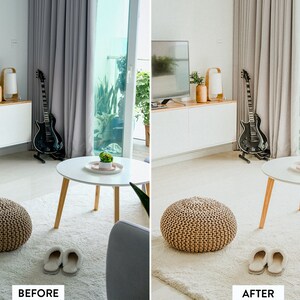 May include: A white living room with a white coffee table, a brown ottoman, and a guitar leaning against a wall. The room has a large window with a view of greenery.