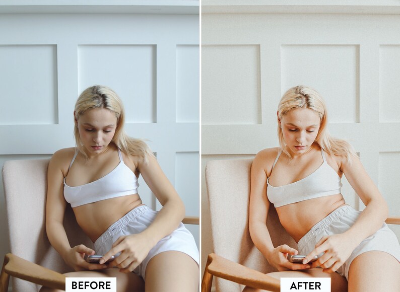 May include: A woman sits in a chair and looks down at a phone in her hands. She is wearing a white tank top and white shorts. The background is a white wall with white trim.