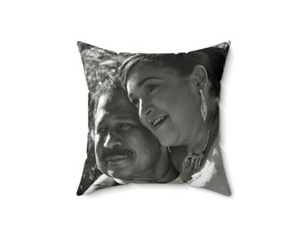 May include: A black and white photo of a couple, a woman with her arm around a man, printed on a throw pillow.
