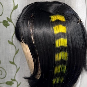 Black and yellow  raccoon tail hair extension