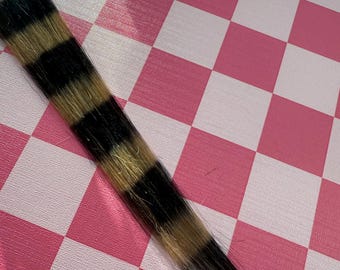Extensiones de cabello de cola de mapache negras y rubias