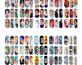 May include: A set of 60 nail stickers featuring images of a K-pop boy band. The stickers are oval-shaped and feature various images of the band members, including close-ups of their faces, full-body shots, and group photos. The stickers also include text such as "NCT DREAM", "BOOM", "We Boom", "Glitch Mode", "Hot Sauce", and "Beatbox".