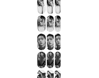 May include: Set of 10 black and white nail decals featuring a man with different hairstyles and outfits. The decals are rectangular and feature a variety of poses.