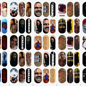 May include: Nail art decals with images from horror films. Designs include characters and scenes from "The Shining", "Scream", "Candyman", "Nightmare on Elm Street", and "It". The decals are oval-shaped and feature various colours.