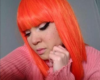 Orange synthetic wig with bangs
