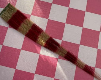 Extensiones de cabello de cola de mapache rubias y rosa oscuro