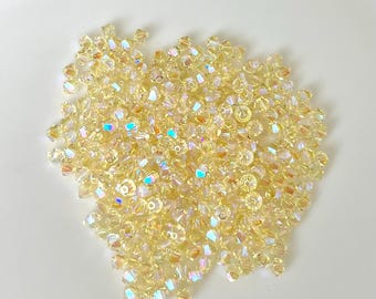 Swarovski 4mm Jonquil AB2X Bicone Beads (50 or 100)