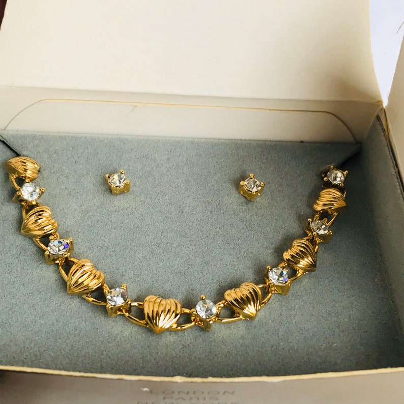 vintage small gold tone 1997 AVON Heart Bracelet and Earring Gift Set clear rhinestone