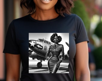 May include: A black short-sleeved t-shirt featuring a graphic print of a person in a military-style uniform standing in front of a vintage propeller aeroplane. The graphic is rendered in a black and white style, showcasing the aircraft and uniform.