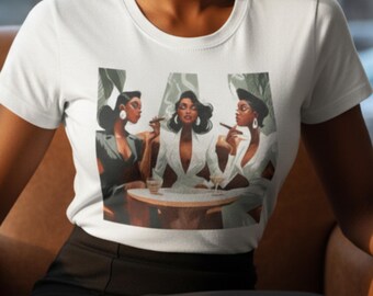 May include: A white short-sleeved t-shirt featuring a graphic print of three individuals seated at a table. The illustration depicts figures in formal attire, with two holding cigars and glasses, set against a backdrop of green foliage.