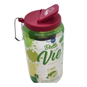 May include: A green and white can of Belle Vie sparkling water with a lime flavor. The can has a red flip top lid with a chain attached. The can says "Sodium Free | Calorie Free | Sugar Free" and "PurAqua Belle Vie Sparkling Water Lime".