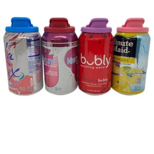 May include: Four 12-ounce aluminum cans of different sparkling beverages. The cans are red, pink, blue, and yellow with various brand names and flavors. The cans have colorful lids.
