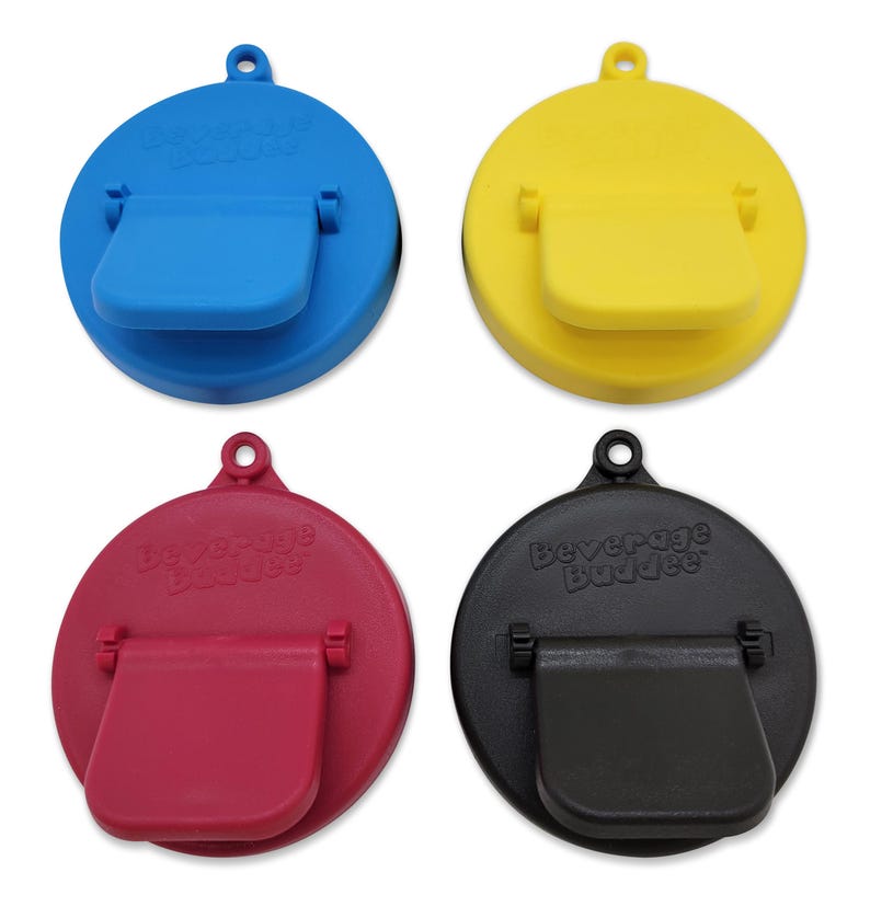 May include: Four beverage bottle stoppers in different colors: blue, yellow, red, and black. Each stopper has a flip-top lid and the words "Beverage Buddies" printed on the top.