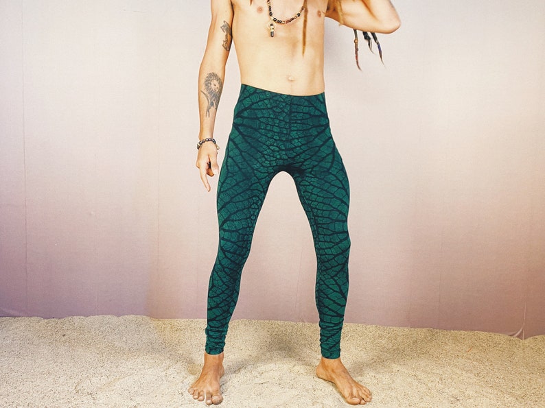 May include: Green leggings with a leaf pattern. The leggings are made of a stretchy material and have a high waist.