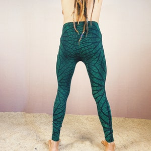 May include: Green leggings with a leaf pattern.
