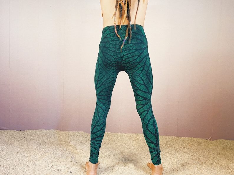 May include: Green leggings with a leaf pattern.