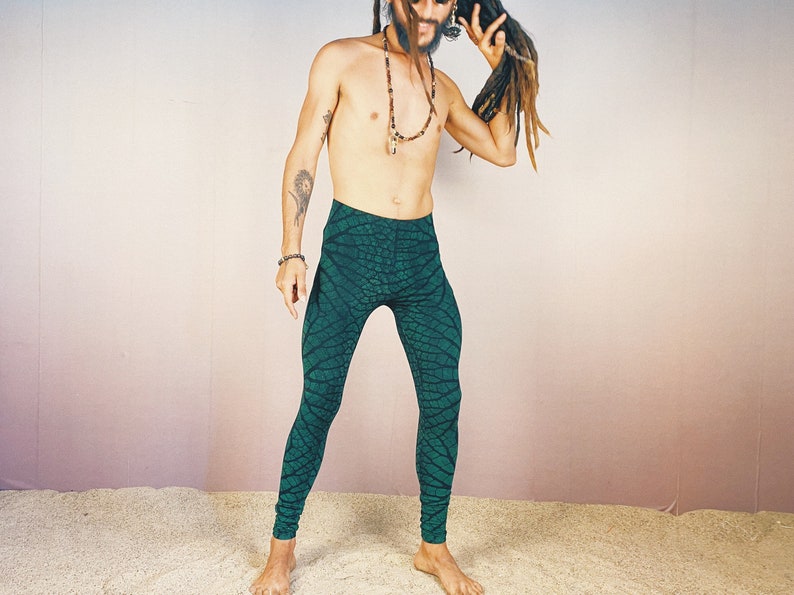 May include: Green leggings with a leaf pattern. The leggings are made of a stretchy fabric and have a high waist.