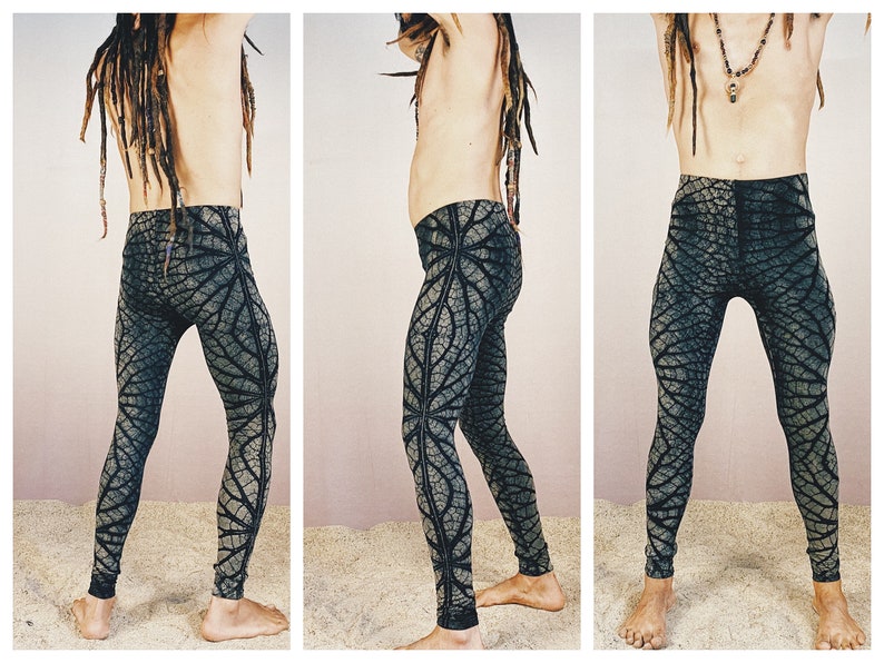 May include: Black and green patterned leggings with a leaf design. The leggings are fitted and have a stretchy fabric.