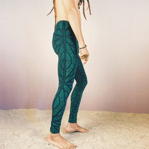 May include: Green leggings with a leaf pattern. The leggings are made of a stretchy fabric and have a comfortable fit.