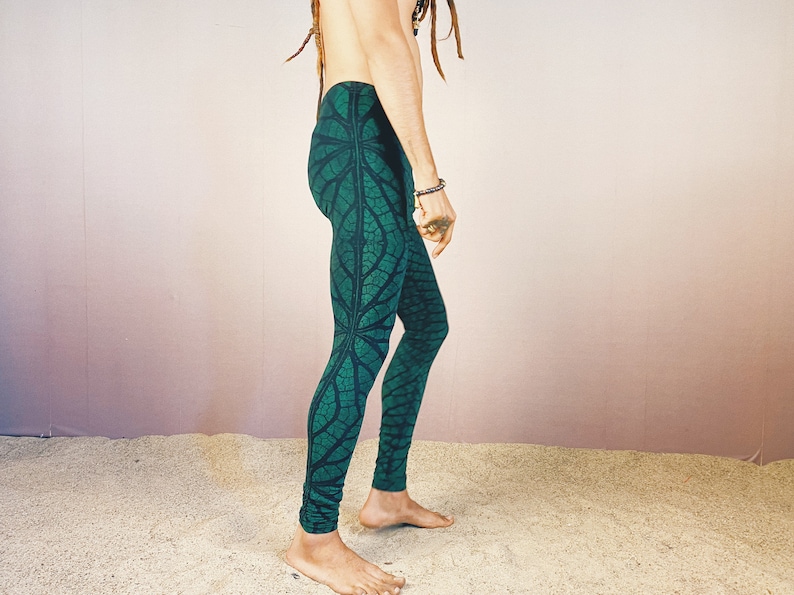 May include: Green leggings with a leaf pattern. The leggings are made of a stretchy fabric and have a comfortable fit.