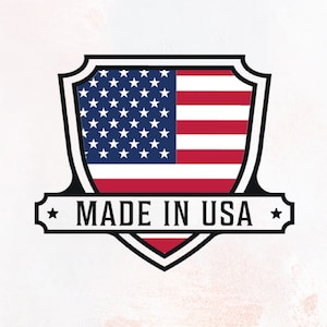 May include: A black and white shield-shaped logo with a red, white, and blue American flag inside. The text "MADE IN USA" is written in black on a white banner below the shield.