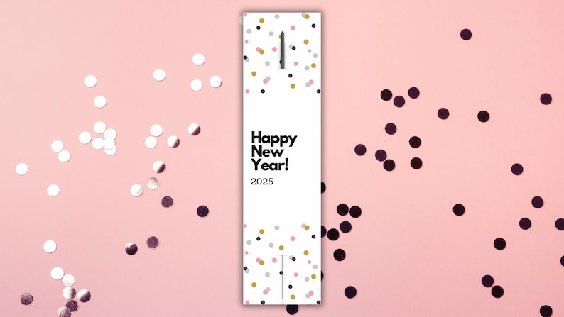 May include: A white card with black text that says "Happy New Year! 2025" surrounded by gold, pink, and black confetti.