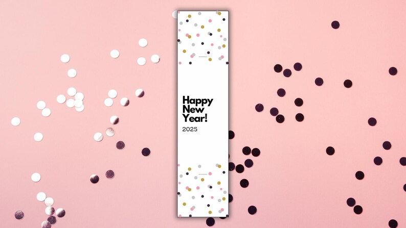 May include: A white card with black text that reads "Happy New Year! 2025" surrounded by pink and black confetti.
