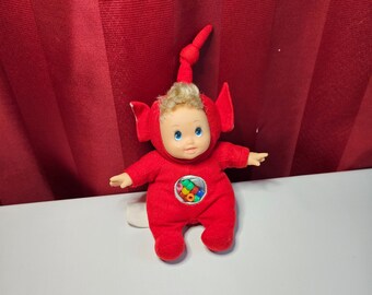 Red Télétitwit plush doll with colored balls in her belly
