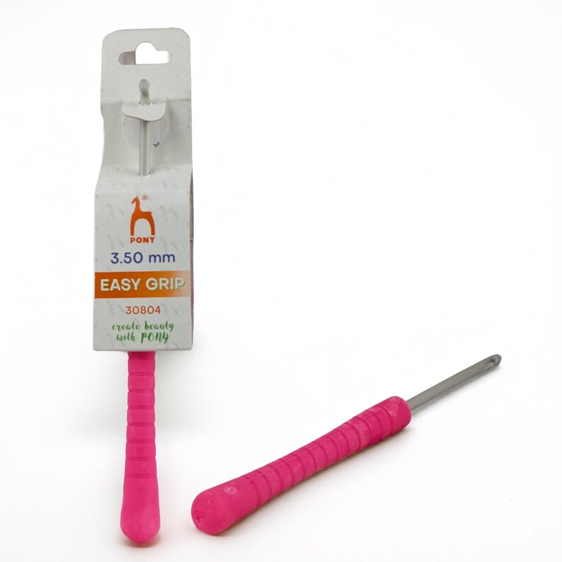 May include: A pink crochet hook with an easy-grip handle, labeled "PONY 3.50 mm EASY GRIP." The hook is shown with its original packaging, which includes the PONY logo and the text "create beauty with PONY."